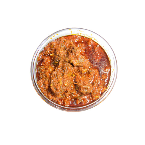 Top view of a bowl filled with spicy Kakarakaya Pickle, ready to serve.