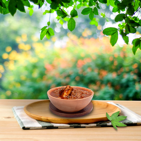 A close-up of homemade Gongura Mutton Pickle, rich in color and aroma.