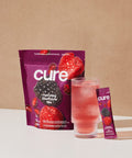 Cure Hydrating Electrolyte Mix | Electrolyte Powder for Dehydration Relief | Made with Coconut Water | No Added Sugar | Vegan | Paleo Friendly | Lemon + Berry Pomegranate Bundle | 28 Packets