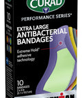 Curad Performance Series IRONMAN Antibacterial Bandages Extreme Hold Adhesive Technology Extra Large Flexible Fabric Bandages for Cuts Scrapes & Burns Assorted Colors 2 x 4 inches 10 Count