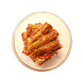 A bowl of pickled drumsticks, a taste of India.